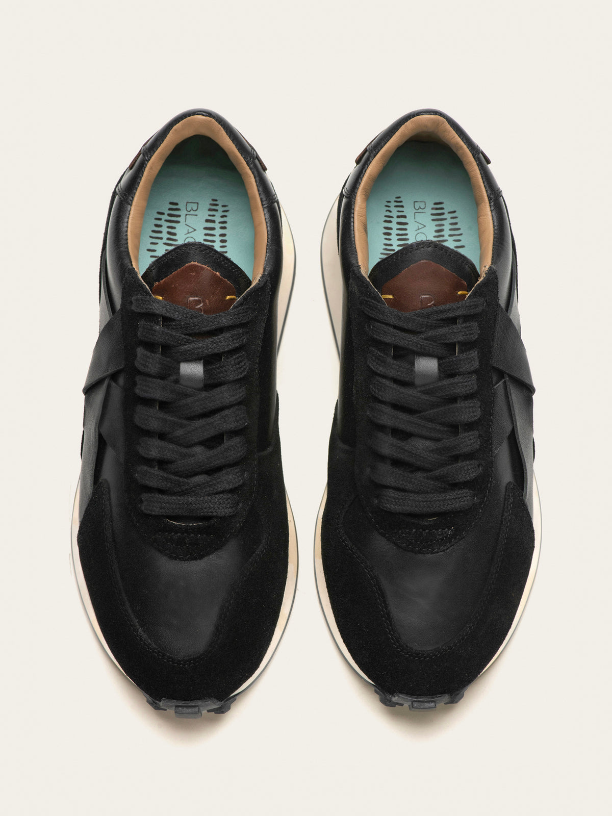 Black Tulip Arbi Sleek Sneaker in Black Leather — women's leather trainers, styled on-foot