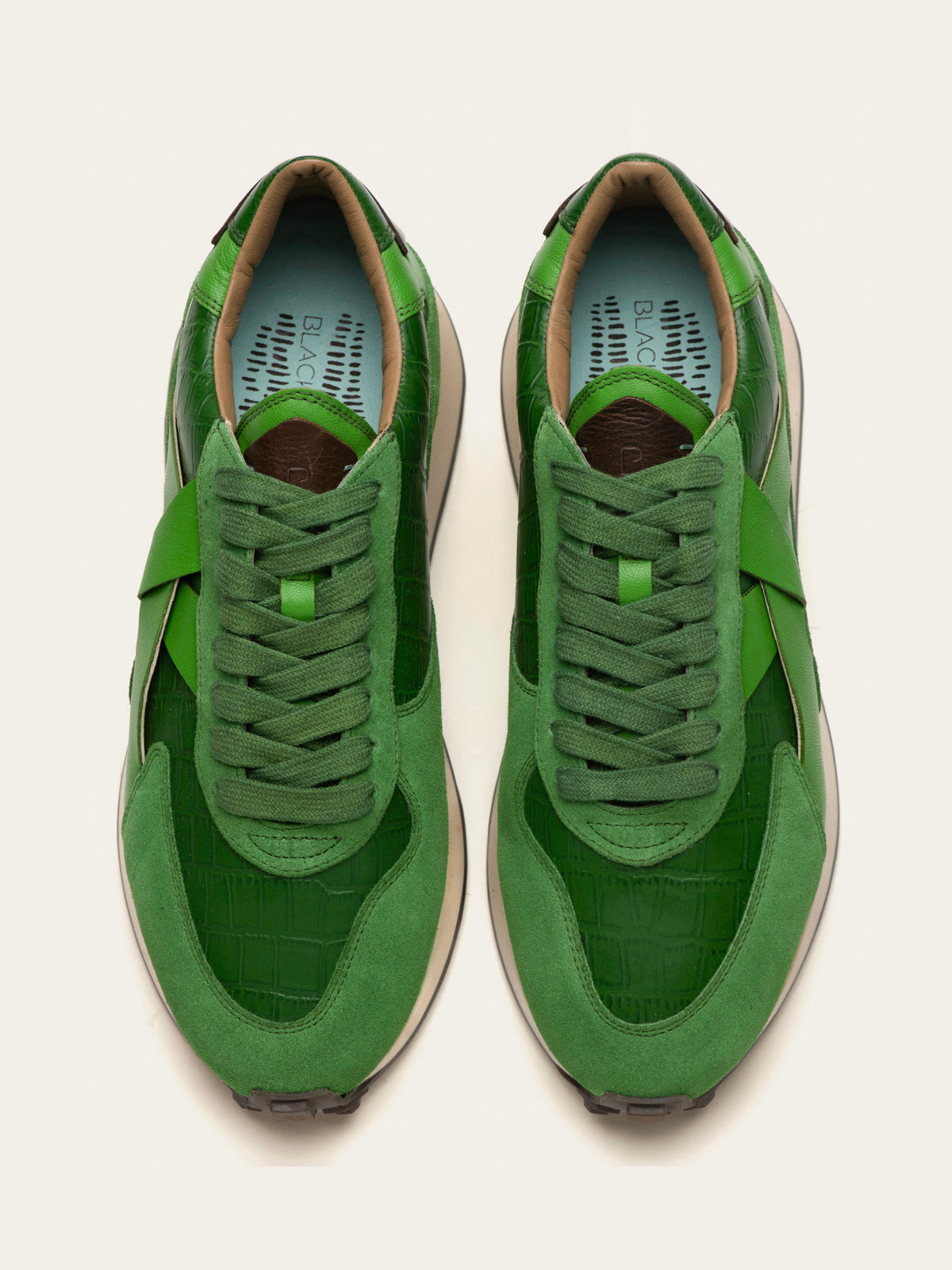 Black Tulip Arbi Sleek Sneaker in Botanical Green — women's leather trainers, three-quarter view