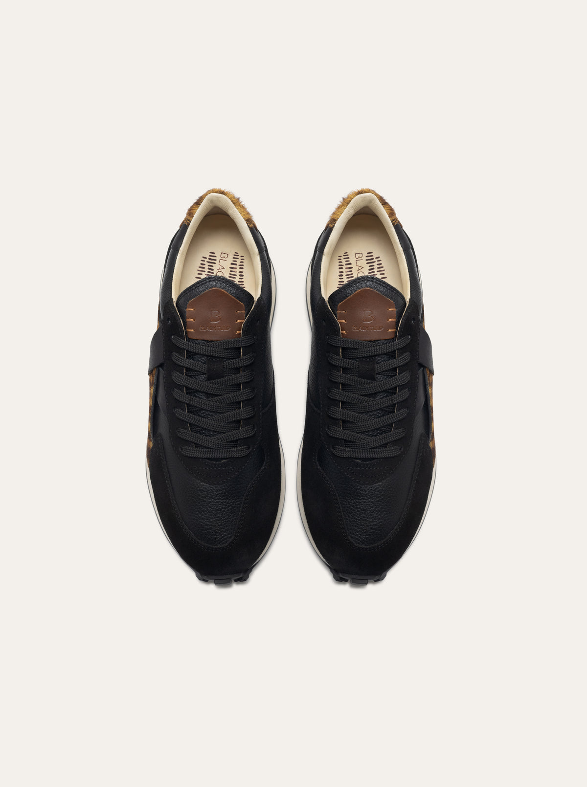 Black Tulip Arbi Sleek Sneaker in Leopard β women's leather trainers, three-quarter view