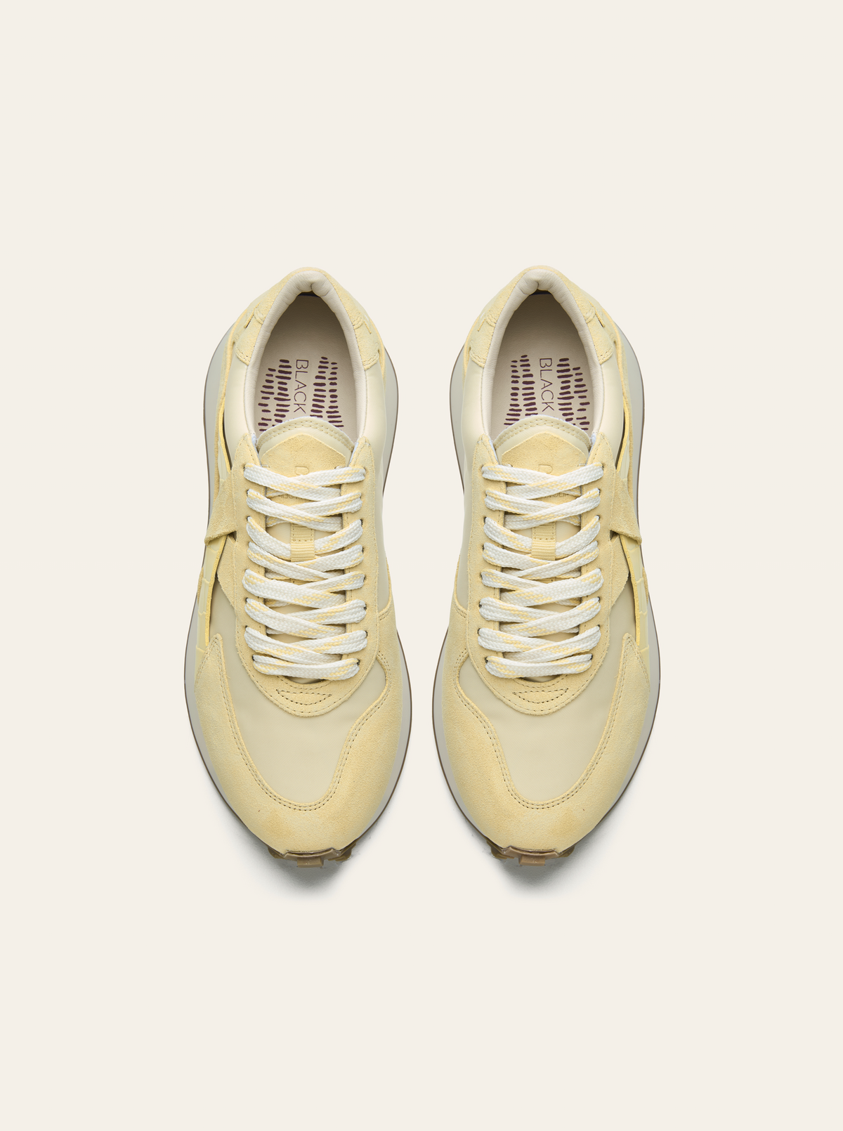 Black Tulip Arbi Sleek Sneaker in Butter Yellow β women's leather trainers, three-quarter view