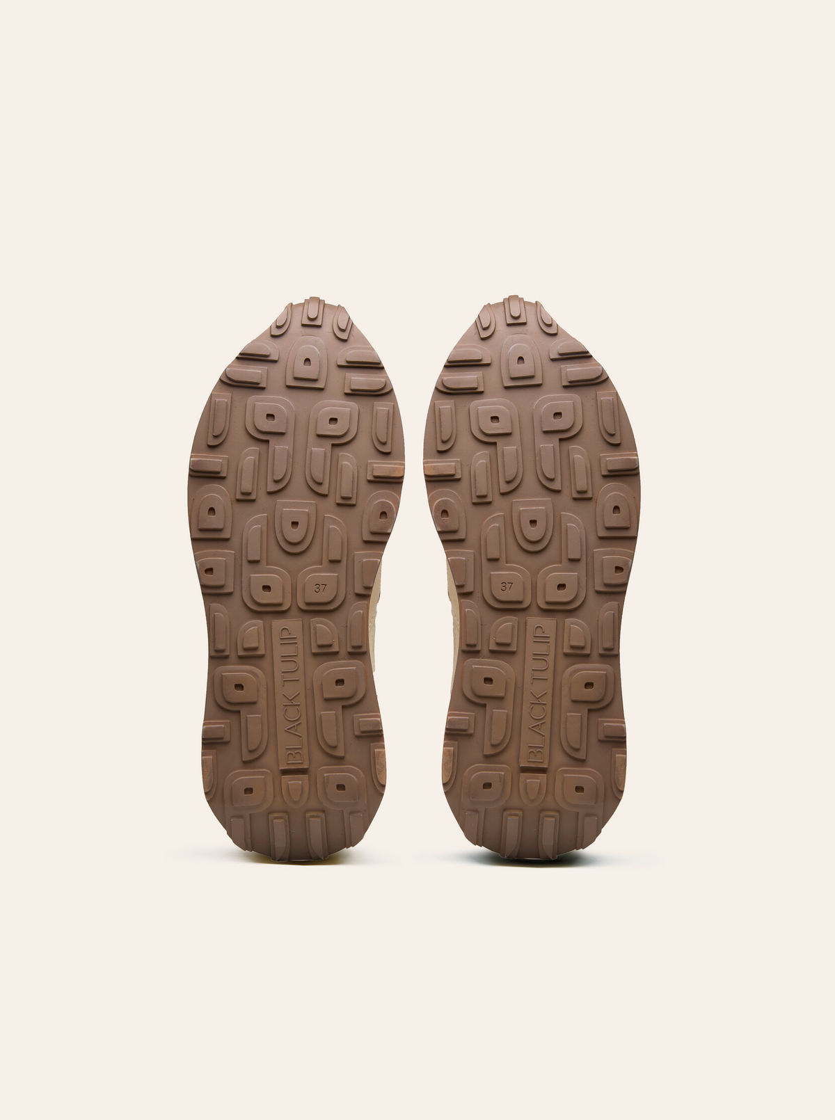 Black Tulip Arbi Sleek Sneaker in Sand β women's leather trainers, styled on-foot