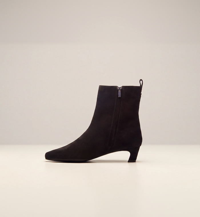 Iris Kitten Heel Ankle Boot in Black suede, side view showing the zip and the slim kitten heel